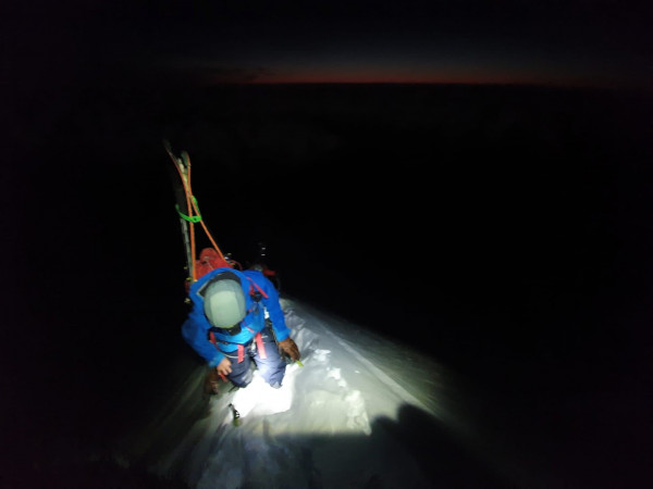 Will Rowntree on East Ridge with first light on the horizon